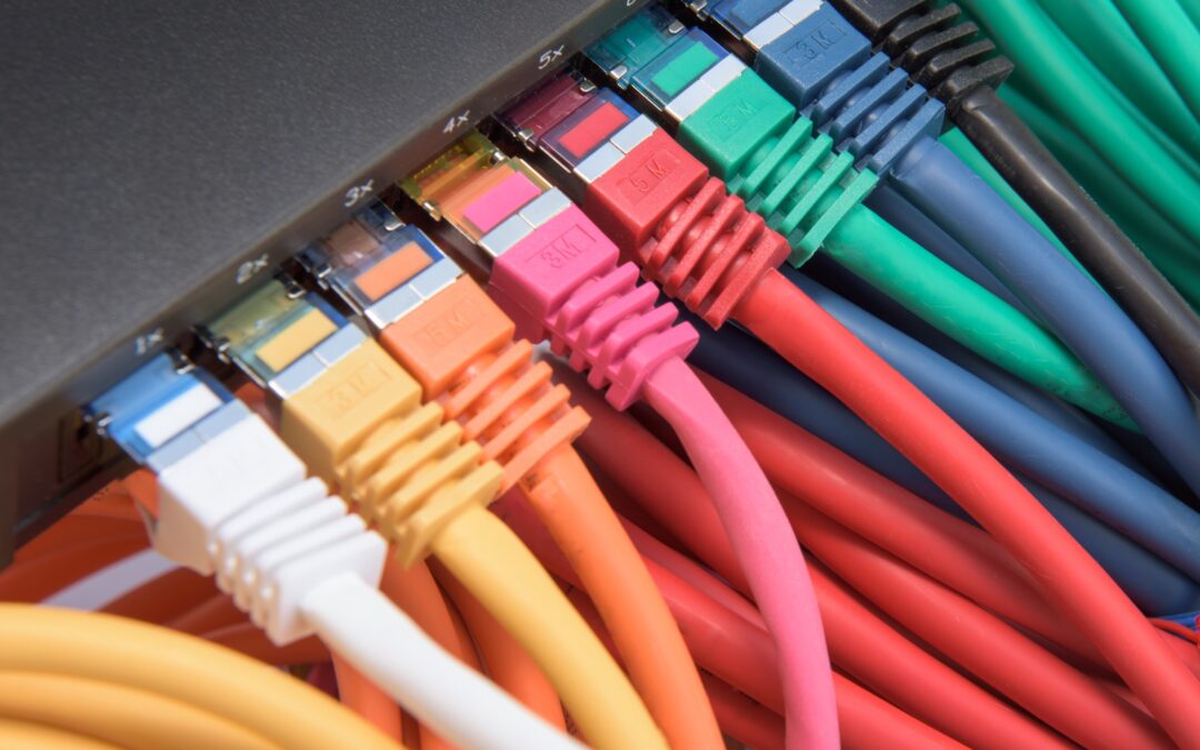 Colorful cat6 cables connect to a switch.